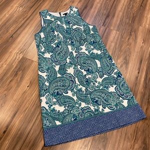 Lot of two size 12 dresses. One black Le Suit, one blue/green Ann Taylor print.